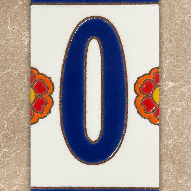 Decorative number '0' tile with floral designs on a beige background