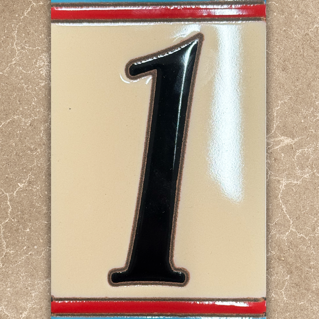 Decorative house number '1' with a colorful border on a beige background