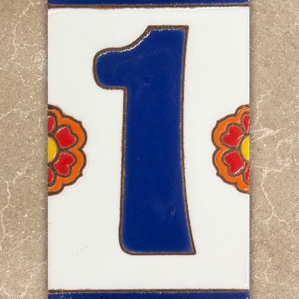Decorative tile with the number '1' on a beige background