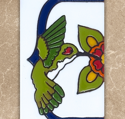 Decorative tile with a green bird, red flowers, and blue border on a beige background