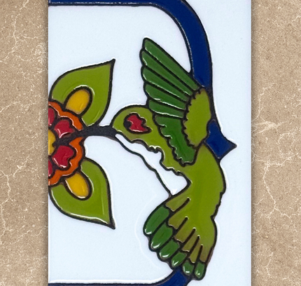 Decorative tile with a green bird and red flowers on a beige background