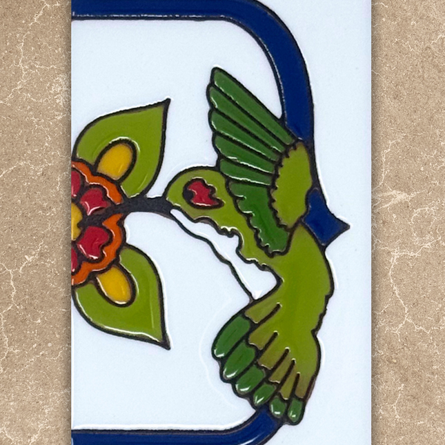 Decorative tile with a green bird and red flowers on a beige background