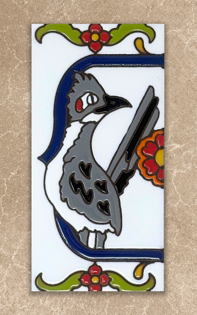 roadrunner talavera end cap house number tile on beige background