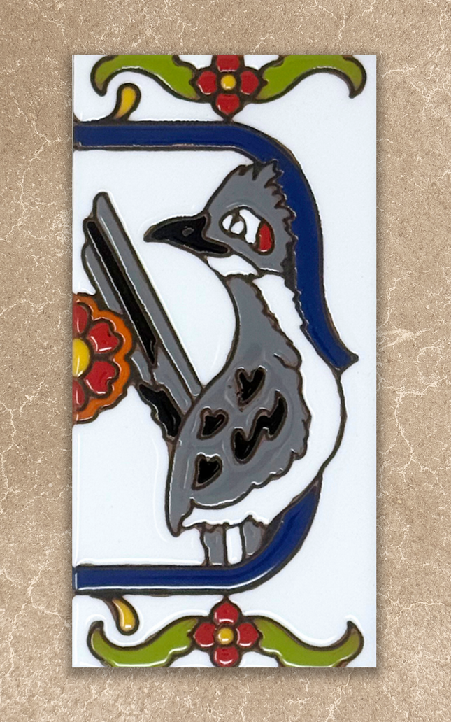 Decorative tile with a stylized bird design on a beige background