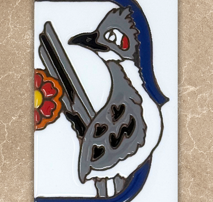 Decorative tile with a stylized bird design on a beige background
