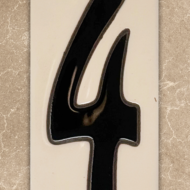 Black number '4' on a beige background