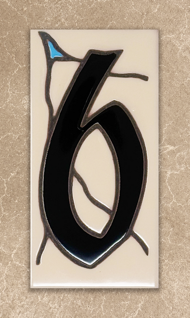 Decorative number '6' with black and blue design on a beige background