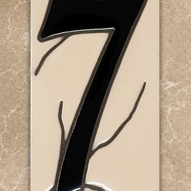 Decorative number '7' with artistic design on a beige background