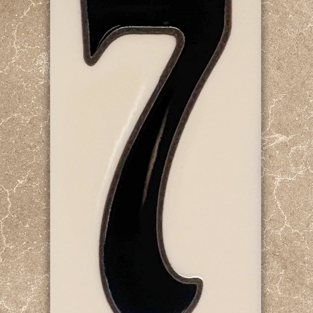 Black number '7' on a beige background