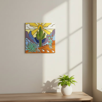 Decorative tile with a desert landscape featuring cacti, a sun, and birds on a beige background.