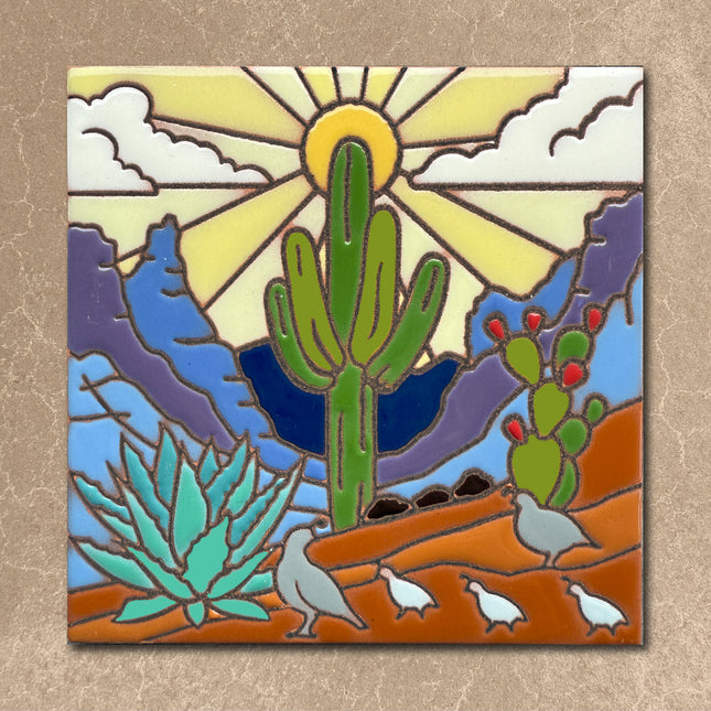 Decorative tile with a desert scene featuring cacti, birds, and a sun.