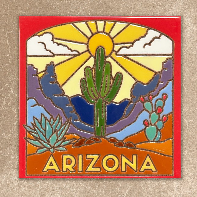 Decorative tile with desert landscape, cacti, and 'Arizona' text on a red border.
