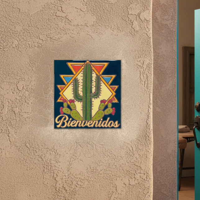 Decorative tile with cactus design and 'Bienvenidos' text on a beige background