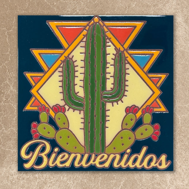 Bienvenidos tile sign with saguaro cactus on blue background