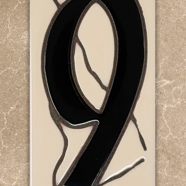 Stained glass number '9' on a beige background