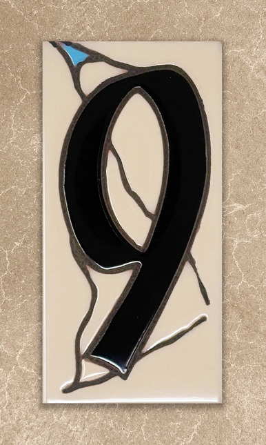 Stained glass number '9' on a beige background