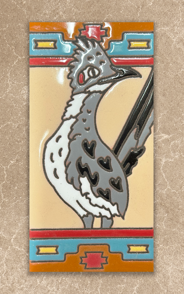 Decorative tile with a stylized bird design on a beige background