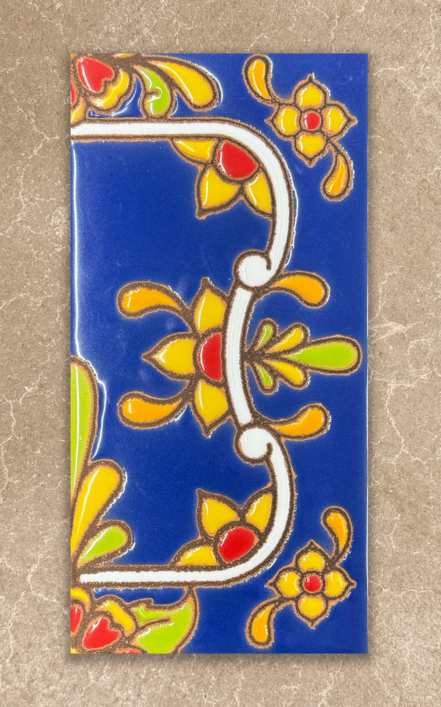 Decorative tile with colorful floral patterns on a blue background