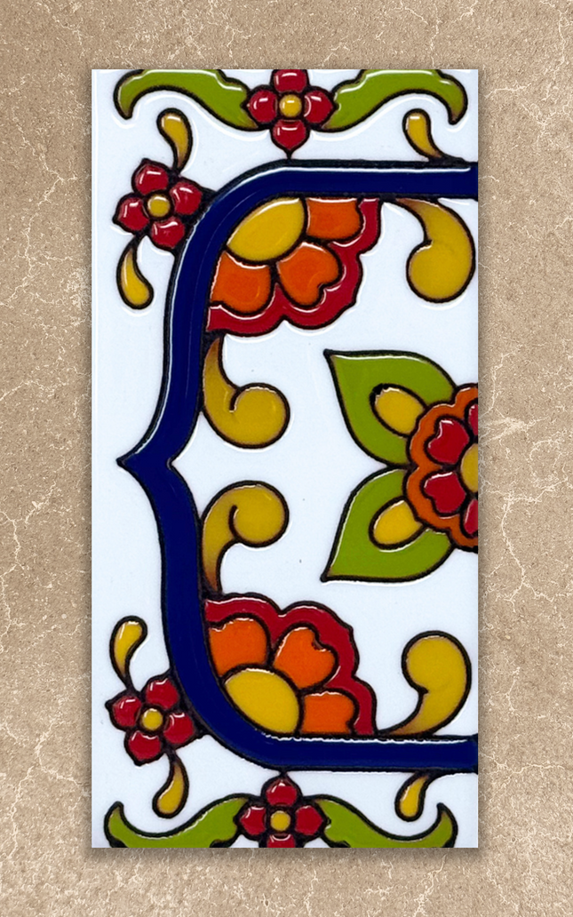 talavera house number end cap tile on beige background