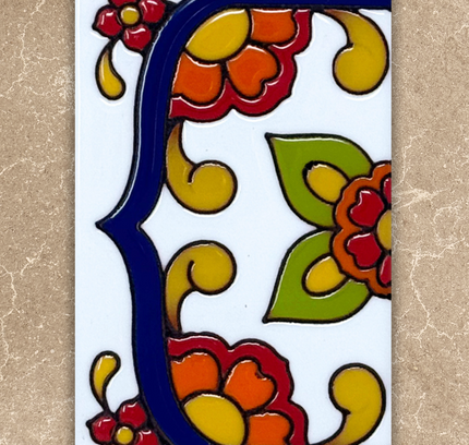 talavera house number end cap tile on beige background