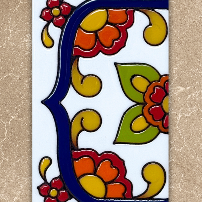 talavera house number end cap tile on beige background