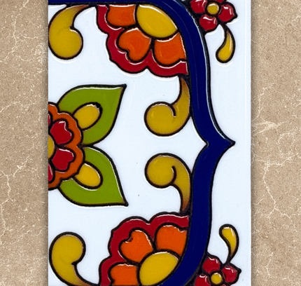 Decorative tile with colorful floral design on a beige background