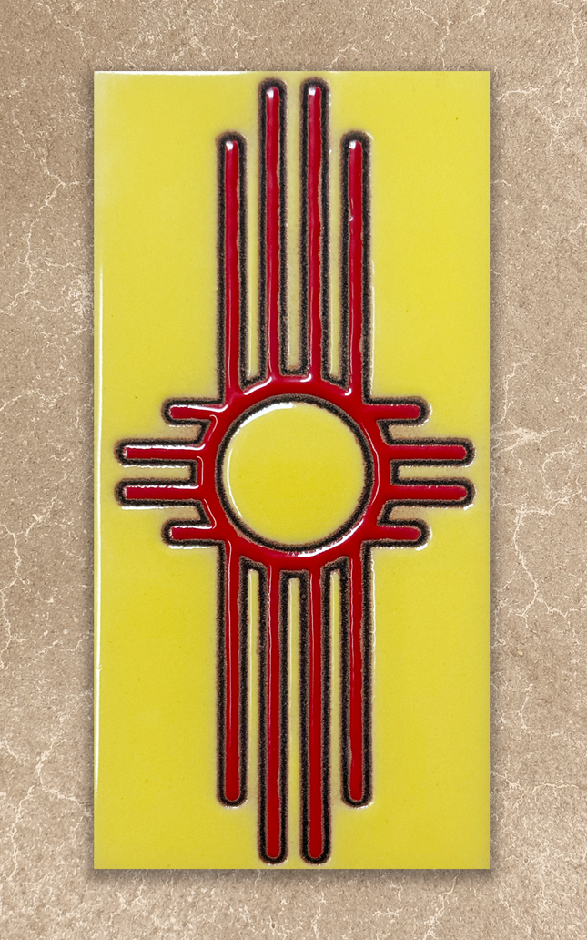 Red and black zia symbol on a yellow background ceramic tile