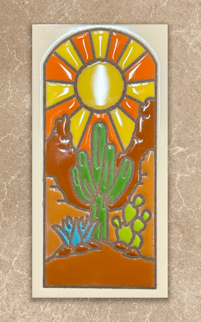 Decorative tile with a cactus and sun design on a beige background