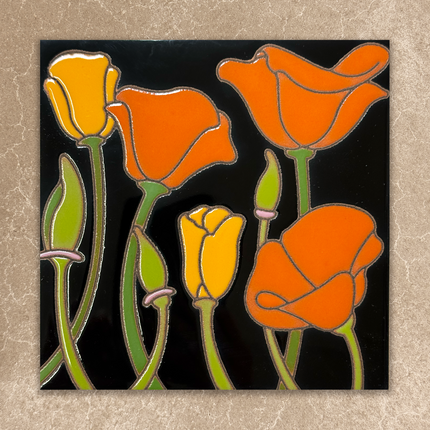Stylized orange and yellow flowers ceramic tile on a black background