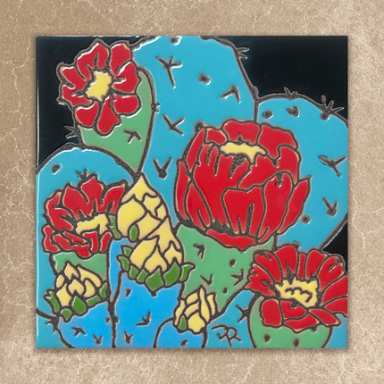 Decorative tile with red and yellow floral cactus design on a black background