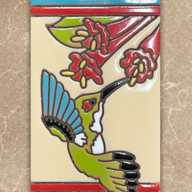 Decorative tile with a hummingbird and floral design on a beige background