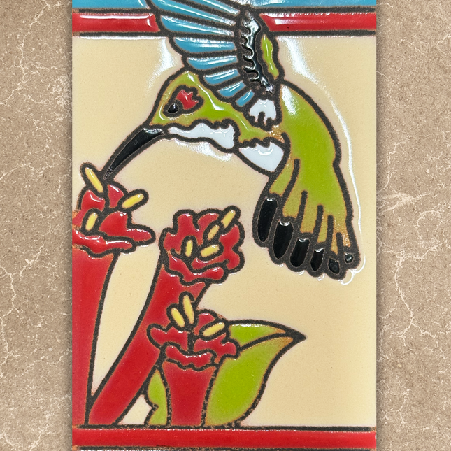 Decorative tile with a hummingbird and flowers on a beige background