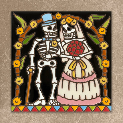 Skeleton couple in wedding attire with floral decorations on a textured background